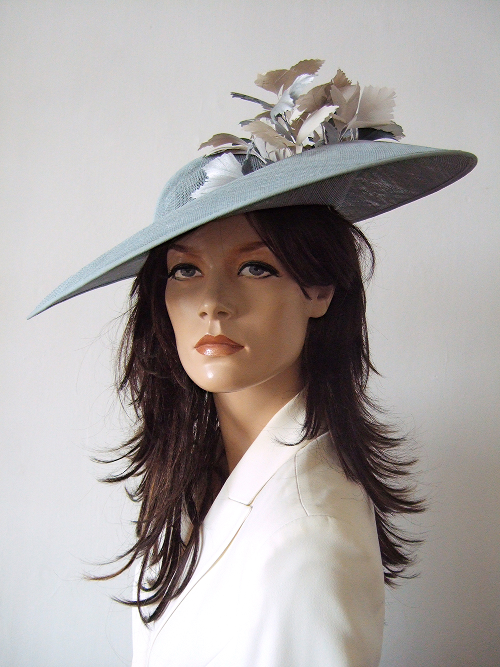 Designer Hats for Hire London. Hostie Hats 2026. Hostie Hats Capri Dish Hat. Mother of the Bride Hats 2026. Hats for Wedding Guests UK. Best Royal Ascot Hats 2026. Designer Hat for Hire 2026. Wedding Hats for Hire UK 2026. Big Blue Hats for the Races. Grey Blue Silver Colour Mother of the Bride Hat Hire 2026. Big Feather Wedding Guest Hats.