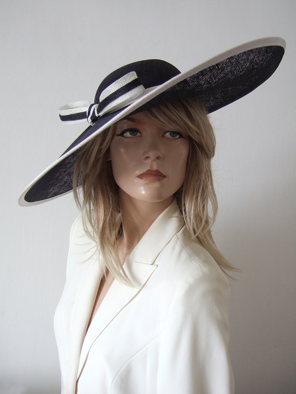 Big Hat for Royal Ascot 2026. Royal Ascot Hat Rental 2026. Hat Hire Berkshire. Amazing Royal Ascot Hats 2026. Ladies Wedding Hats for Hire 2026. Dark Navy and White Mother of the Bride Hats 2026. Navy and White Mother of the Bride Hatinator. Navy Blue and White hat for Royal Ascot 2026. Royal Ascot Hat Rental 2026. Formal Wedding Hats for Hire UK 2026. Hats for the Races 2026.