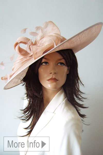 Nude Pink Floral Mother of the Bride Hat. Nude Pink Mother of the Bride Hat Hire. LargeHats for Royal Ascot. Large Nude Pink Colour Hats for Mother of the Bride 2026. Modern Mother of the Bride Hats. Royal Ascot Hats for Hire 2026. Hat Hire for Royal Ascot.