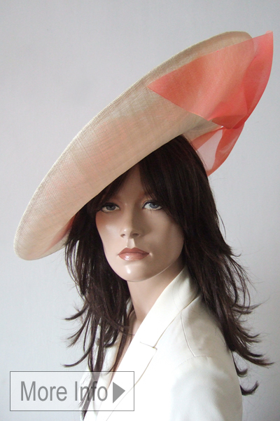 Awon Golding Mother of the Bride Hat. Royal Ascot Hat Hire 2026. Awon Golding Designer Hats 2026. Amazing Hats for Royal Ascot Races 2026. Coral and Cream Wedding Hats. Royal Ascot Designer Hats 2026. London Hat Hire. Coral and Cream Mother of the Bride Outfits. Where to Hire Hats UK.