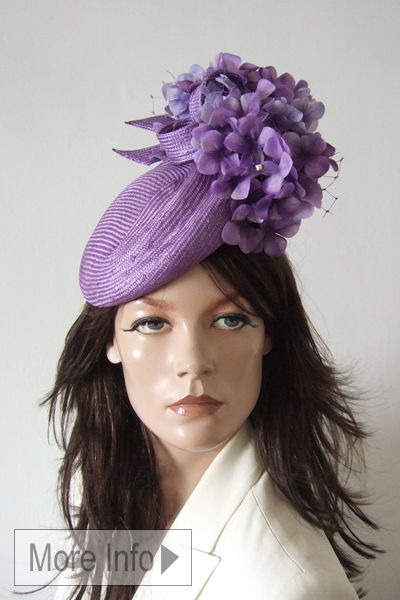 Lilac Floral Ascot Hat Headpiece 2026. Lilac Hats for Royal Ascot 2026. Royal Ascot Hats for Hire 2026. Ascot Hat Hire. Lilac Mother of the Bride Hat 2026. Juliette Botterill Hats. Beret style Ascot Hats 2026. London Hat Hire. Lilac Mother of the bride Hat.
