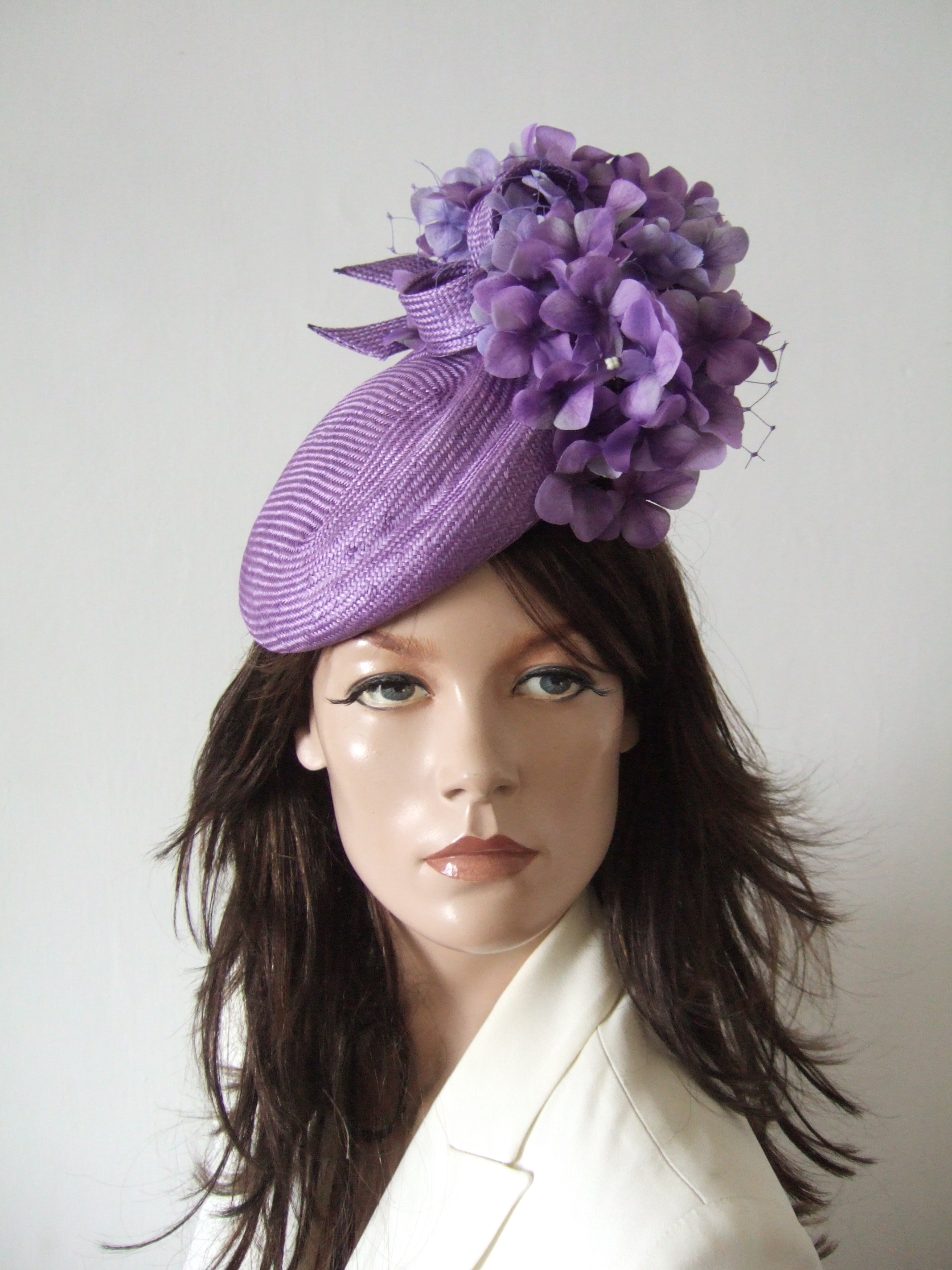 Lilac Headpiece for Royal Ascot 2026. Royal Ascot Hat Rental 2026. Juliette Botterill Beret Headpiece. Hat Hire Berkshire. Amazing Royal Ascot Hats 2026. Ladies Wedding Hats for Hire 2026. Hats for Epsom Races 2026. Lilac Mother of the Bride Hats 2026. Royal Ascot Hat Rental 2026. Formal Wedding Hats for Hire UK 2026. Hats for the Races 2026.