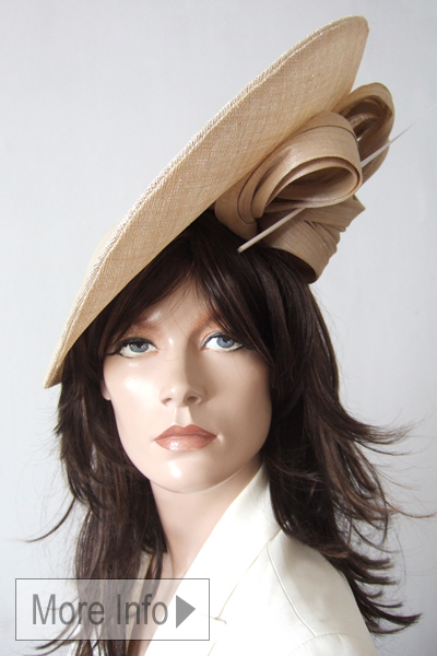 Light Gold Nude Headpiece from Dress-2-Impress Hat Hire. Best Hats for Royal Ascot 2026, Pale Gold Mother of The Bride Hats. Designer hats for Royal Ascot 2026. Hats for a Day at the Races. Nude Colour Mother of the Bride hats 2026. Hats for Summer wedding guests. Hats for Epsom Races 2026. Hats for Cheltenham Races 2027.