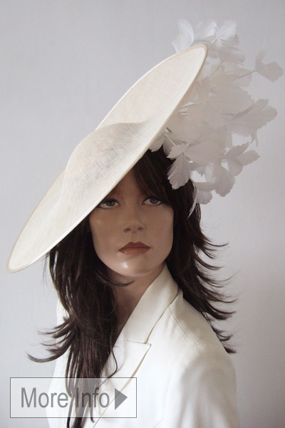 Ivory and White Headpiece Fascinator, Fashionable Disc Shape Hat Hire. Designer Ivory Hat for Royal Ascot 2026. Ivory Mother of the Bride Hat Hire 2026. Royal Ascot Hat Rental 2026.  Best Hats for Royal Ascot Races 2026. 