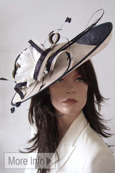 Snoxells Navy and Ivory Hatinator. Designer Hats for Royal Ascot 2026, Royal Ascot Hat Hire 2026. Navy and Ivory Mother of the Bride Hats 2026. Navy Hat for Royal Ascot 2026. London Hat Hire. Hat Hire near London. Navy Mother of the Bride Hats for Hire 2026. www.dress-2-impress.com Hat Hire Berkshire.