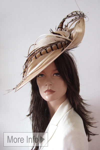 Vivien Sheriff Pheasant Nude Headpiece from Dress-2-Impress Hat Hire. Best Hats for Royal Ascot 2026, Mother of The Bride Hats. Designer hats for Royal Ascot 2026. Hats for a Day at the Races. Nude Colour Mother of the Bride hats 2026. Hats for Winter wedding guests. Hats for Epsom Races 2026. Hats for Cheltenham Races 2026.